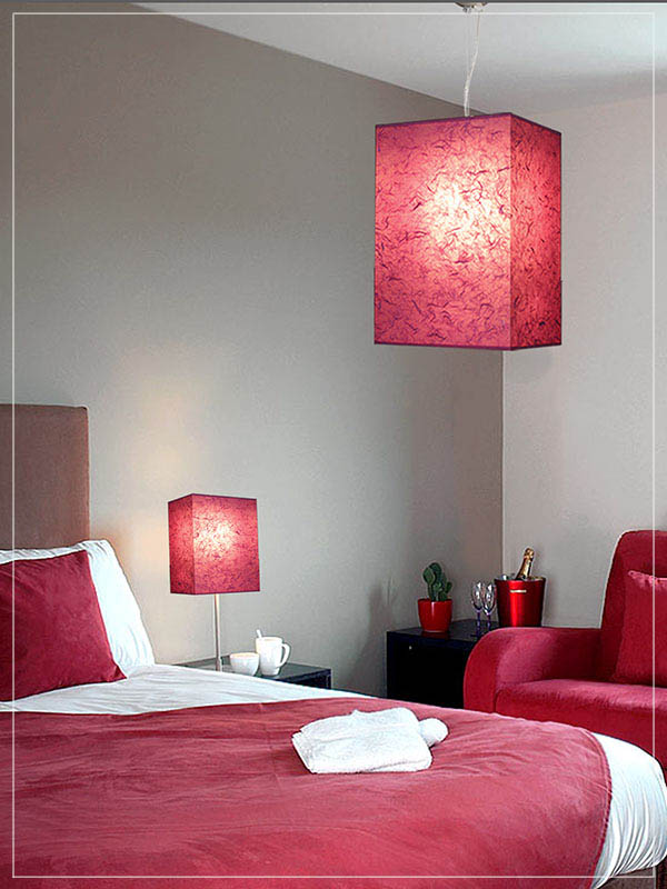 Pendant and Table Cube Lamp Shade in a bedroom.