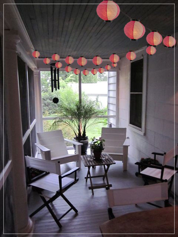 Garland with multicolor lanterns in a exterior enviroment.