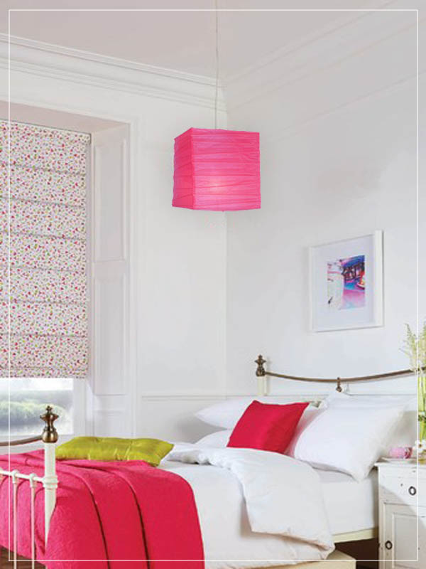 Pink square pendant lantern in a bedroom.